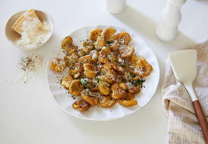Rezept für gewürzte Stampfkartoffeln mit Kräutern und Parmesan